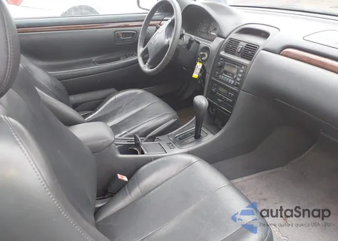 1999 Toyota Camry Solara Sle z USA, uszkodzony, nr VIN 2T1CF22P2XC252320